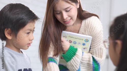 school kids researching with the guidance of teacher in classroom Education knowledge, successful teamwork concept.
