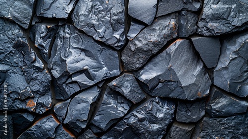   A meticulously crafted close-up of a metal-like rock wall, coated in a uniformly applied black paint