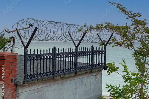 Metal razor wire safety fence outside house property