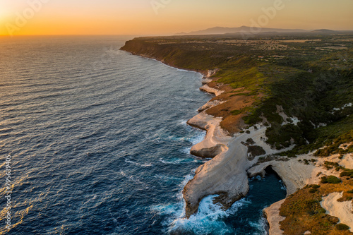 Breathtaking sunset view of Sardinian coastline, Su Riu de Sa Ide photo