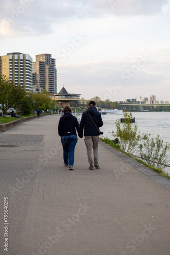 Couple walking at the river rhine in cologne