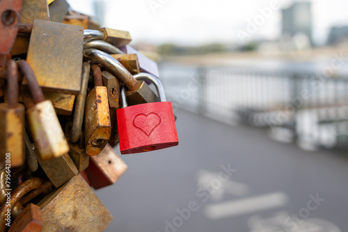 many love locks on a bridge