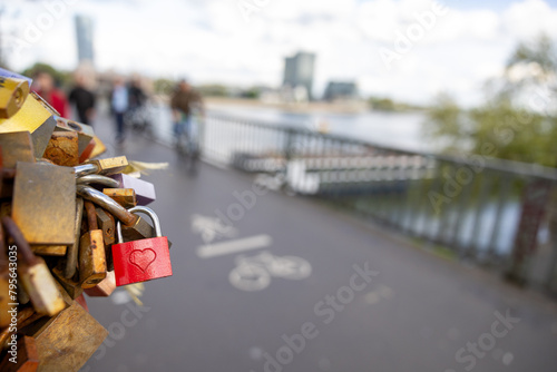 Lovelock on a bridge with people in the background
