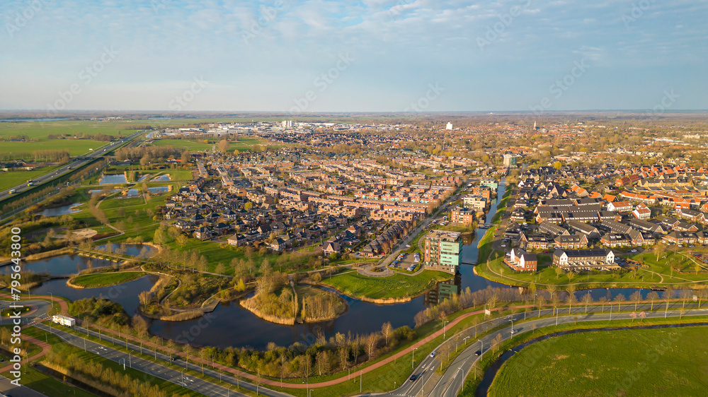 Aerial drone view of the city of Nijkerk, the Netherlands during sunset
