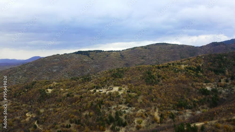 Cinematic drone video of mountain Nidze under heavy blue overcast Cinematic drone video of mountain Nidze under heavy blue overcast