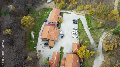 Hunting resort on mount Nidze surrounded with woods viewed from air photo