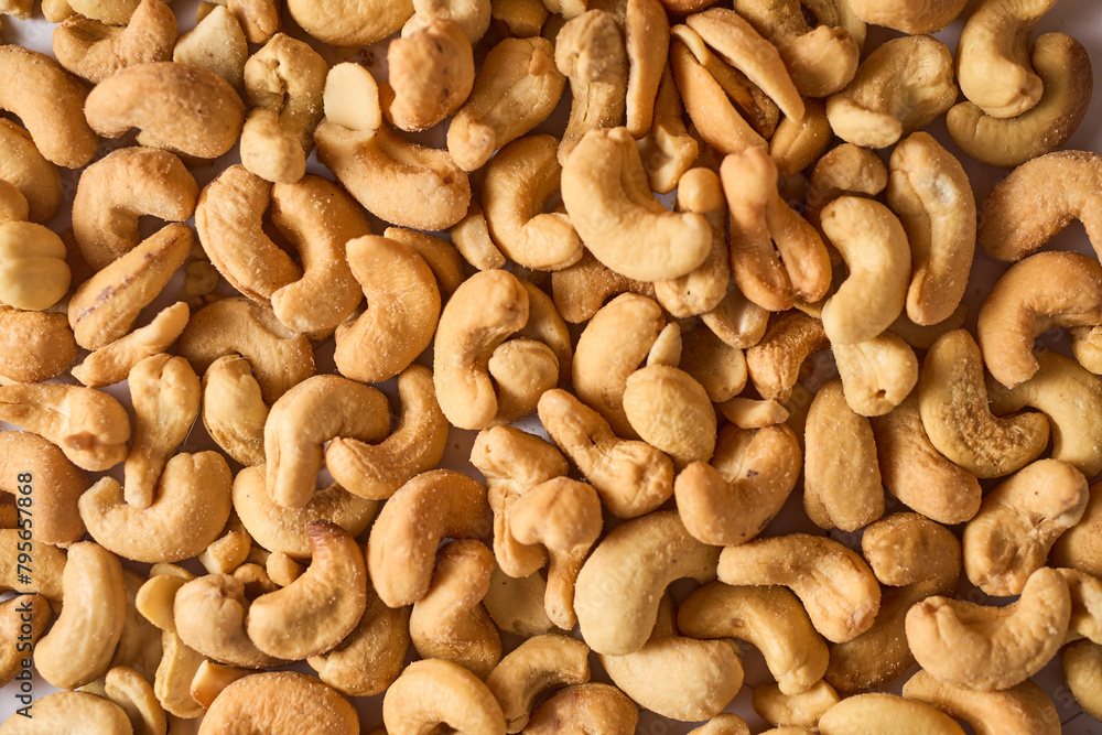 Close up of cashew nuts background. Top view. Close up of cashew nuts background. Top view.