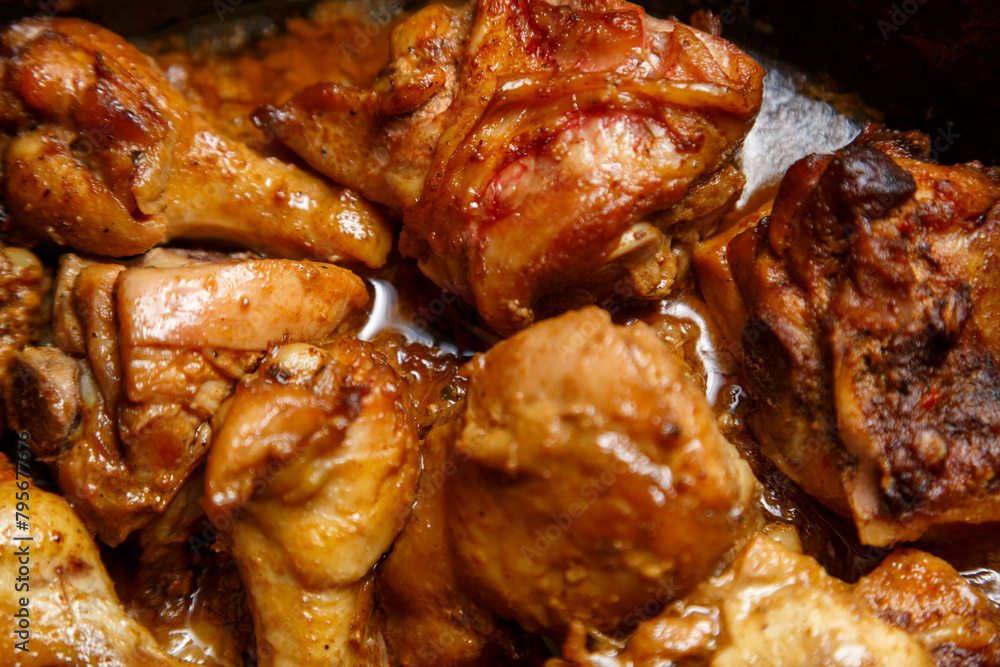 chicken breast pieces in a frying pan stewed in sauce and spices chicken breast pieces in a frying pan stewed in sauce and spices