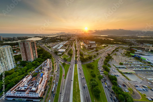 Aerial View of Americas Avenue, Alvorada Bus Terminal, and Cidade das Artes Cultural Complex in Rio de Janeiro on Sunset