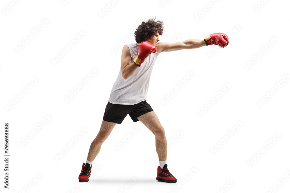 Young man punching with boxing gloves