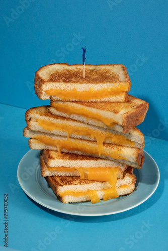 Tall stack of grilled cheese sandwiches