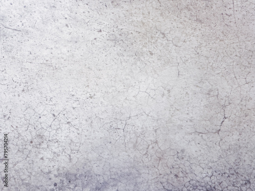 A close-up of a weathered concrete wall with a smooth, gray surface.
