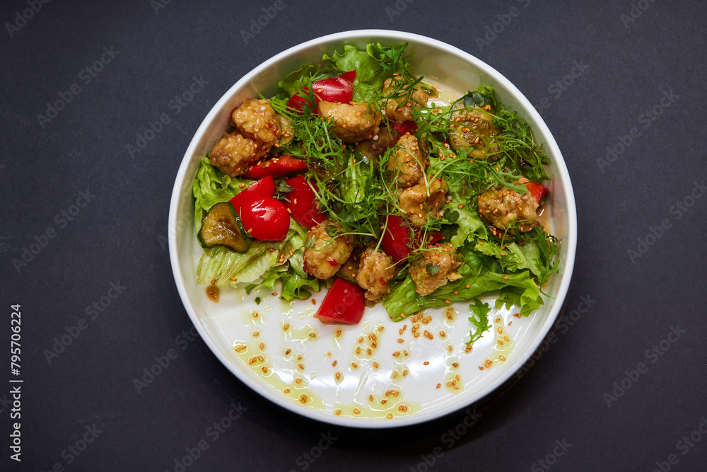 White bowl with lettuce, tomatoes, and chicken salad White bowl with lettuce, tomatoes, and chicken salad