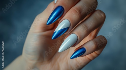 Womans Hand With Blue and White Nail Polish.