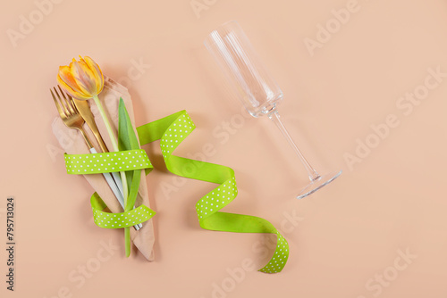 Overhead view of a beautiful table setting with orange tulips  perfect for a romantic dinner or special celebration.