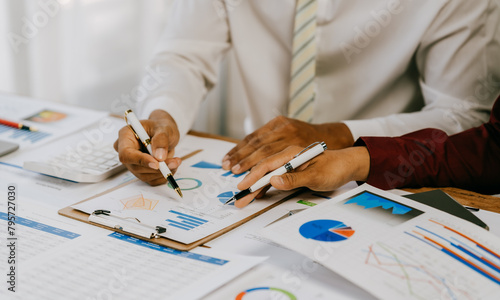 Corporate business people working in busy marketing office space, planning strategy in books and reading email on laptop at work, workers at startup advertising company