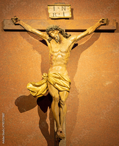 MILAN, ITALY - MARCH 6, 2024: The carved polychrome Crucifixion in the church Basilica di San Babila by unknown artist. 
