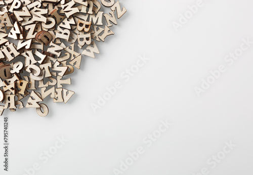 wooden letters of the English alphabet on a gray gradient background