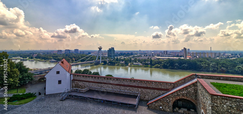 The Danube river behind Bratislava castle with luxury cruises, Bratislava, Slovakia photo