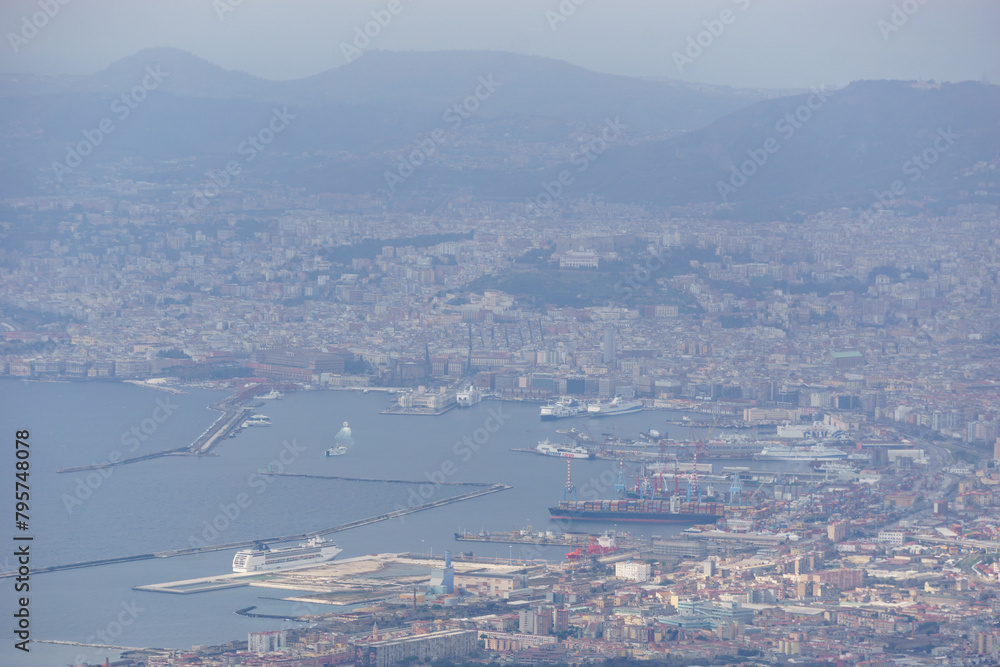 View from the top of Mount Vesuvius down to the city on a hazy winter day, Naples, Campania, Italy