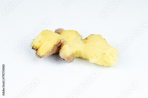 Peeled fresh ginger root on white background