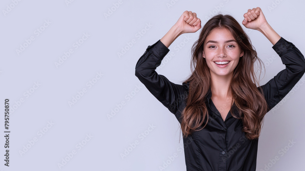 Caucasian businesswoman wearing black shirt, smiling and raised hands Caucasian businesswoman wearing black shirt, smiling and raised hands