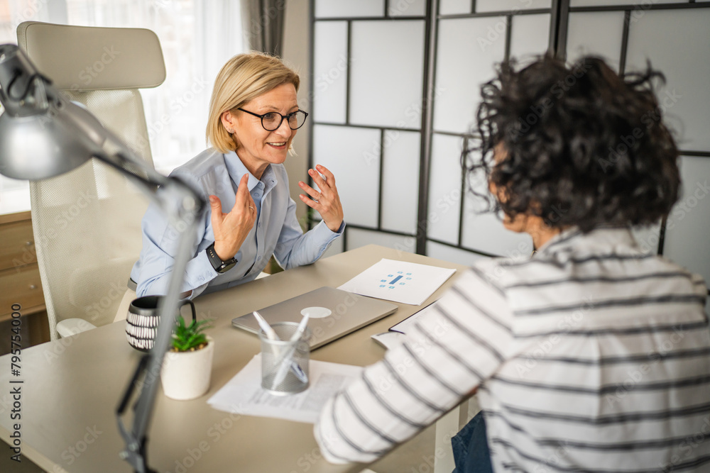 Fototapeta premium Two female colleagues are consult about work at office