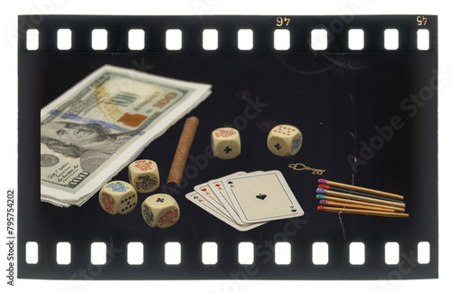 Retro 35mm analog positive film slides Gambling concept, with cards, cigarettes, poker dice and matchsticks with faces painted on the heads photo