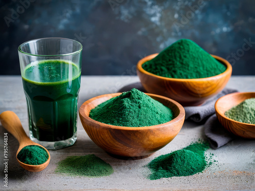 Healthy superfoods, dried spirulina in powder form in the wooden bowl