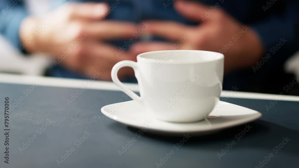 Man Suffering From Stomach Pain With Cup Of Coffee Man Suffering From Stomach Pain With Cup Of Coffee