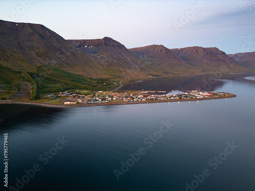 Evening aerial shot of town of Flateyri in the Westfjords of Iceland