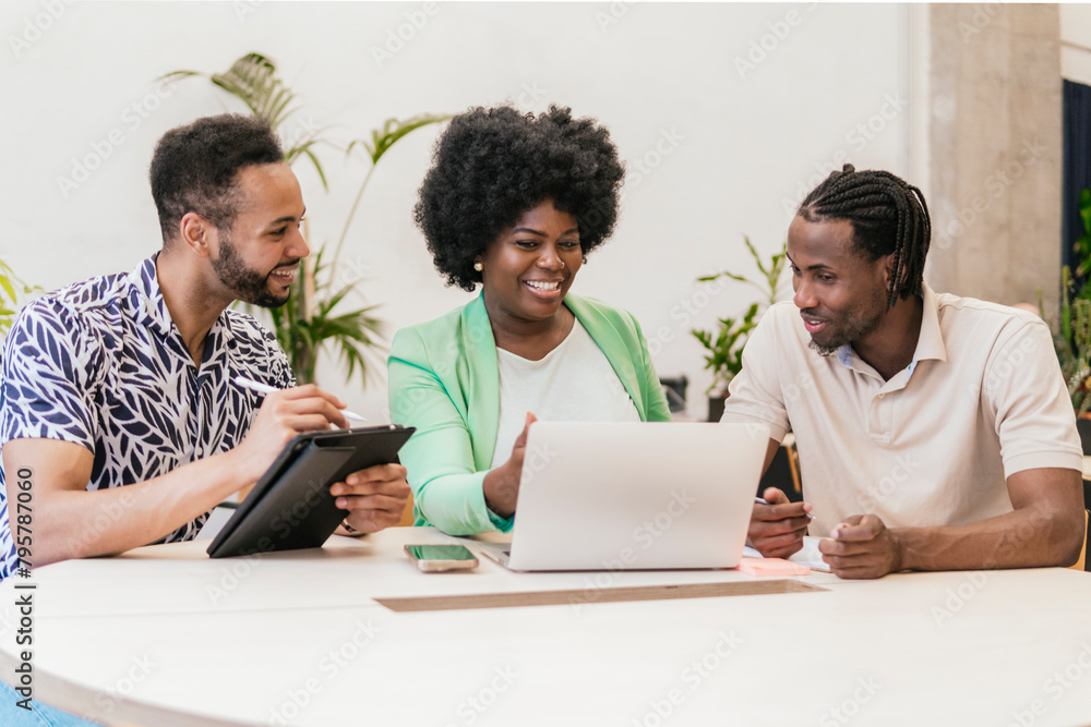 Diverse Team Collaborating in Modern Coworking Space Diverse Team Collaborating in Modern Coworking Space