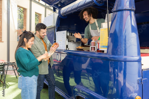 Enjoying Street Food at a Colorful Food Truck photo