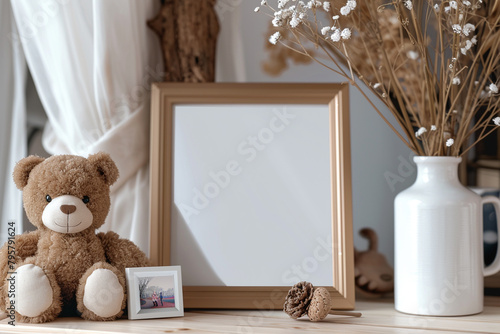 Picture-perfect setup A tabletop featuring a stylish photo frame mock-up complemented by a charming teddy bear decoration.