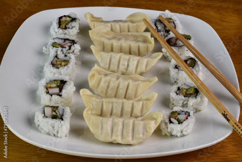 chicken dumblings served with california roll