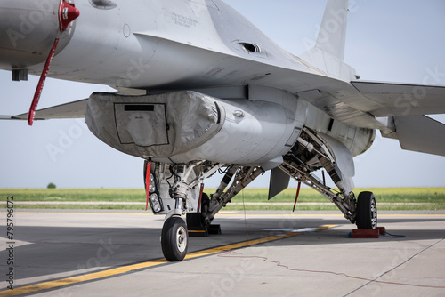 Fighter aircraft in parking position. Detail with landing gear.