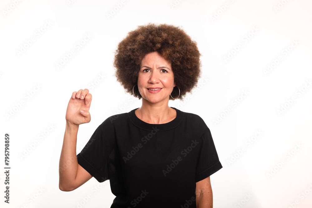 Female interpreter of the Brazilian sign language, Libras, making the letter E. Female interpreter of the Brazilian sign language, Libras, making the letter E.