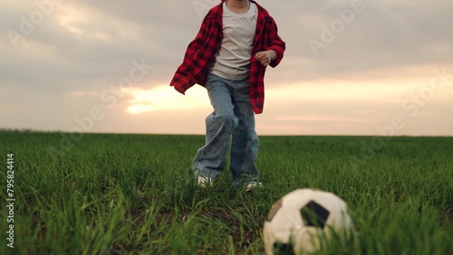 child kid baby girl run across green lawn sunset, kicking soccer ball, playing football field, childhood dream happy kid, youth soccer training, outdoor sports activity, field sports equipment