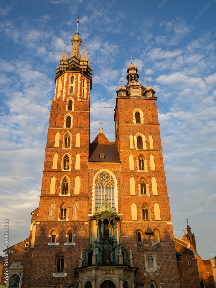 Fototapeta premium The sunset light on the two different towers of St Mary's Basilica, Krakow