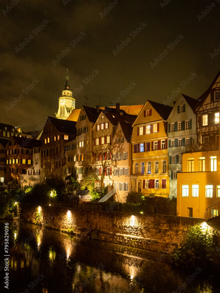 Night shot of Tübingen buildings by Neckar river