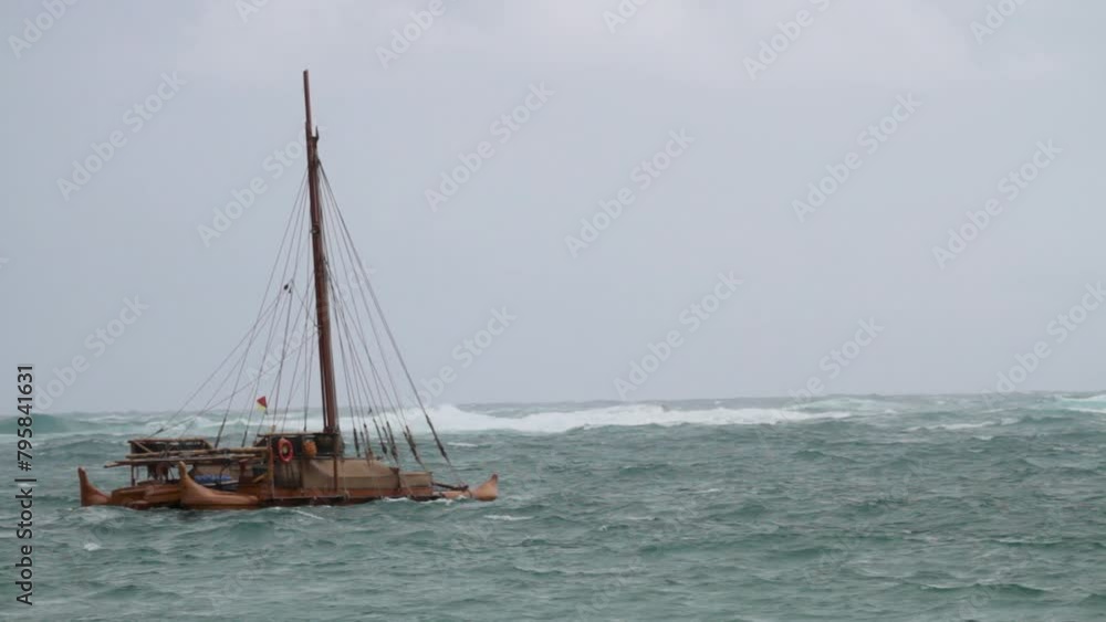 Beautiful old boat floating in epic ocean - wide shot Beautiful old boat floating in epic ocean - wide shot