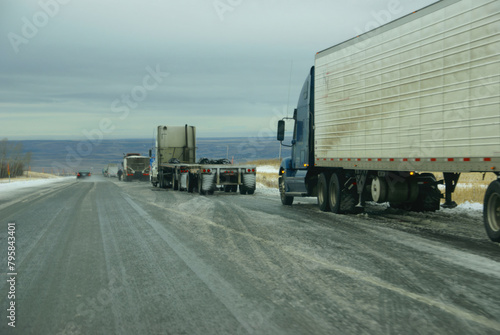 Trucks stop to remove chains