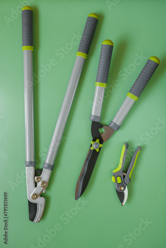  Secateurs, loppers, and hedge trimmers.Garden tools for topiary cutting of plants. Garden equipment and tools. Tools for pruning and trimming plants