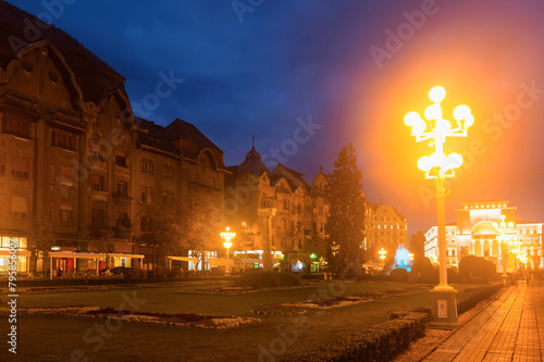 Twilight view of Victoriei Square on background with National Theatre and Opera, Timisoara, Romania