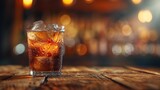 Glass of soda with ice on wooden bar top, bokeh background
