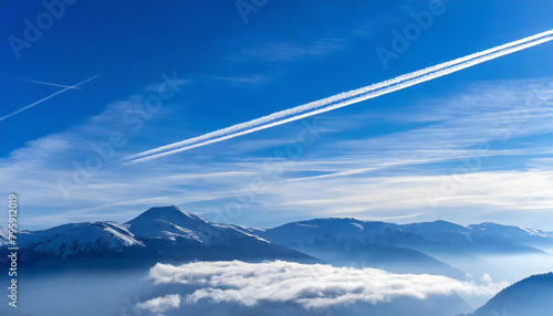 Airplanes and contrails. Blue sky background. A single contrail.