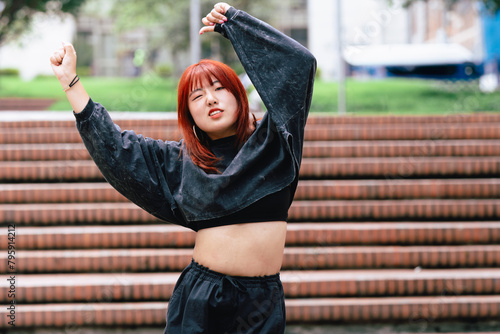 Korean dancer expressing joy through dance on a city stairway