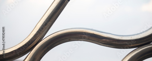 Close up detail of a metal railing with a blurred background and copy space.