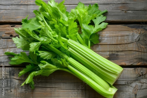 Bunch of fresh green celery on wooden board