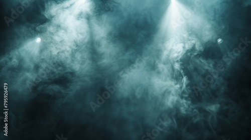 A blue smoke filled room with two lights shining on it